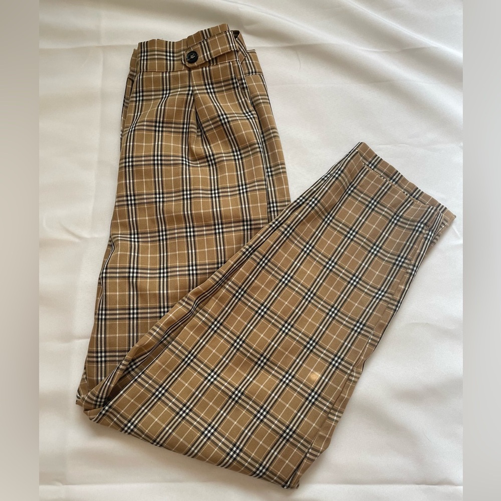 Tan, black and white checkered pants, size Medium.